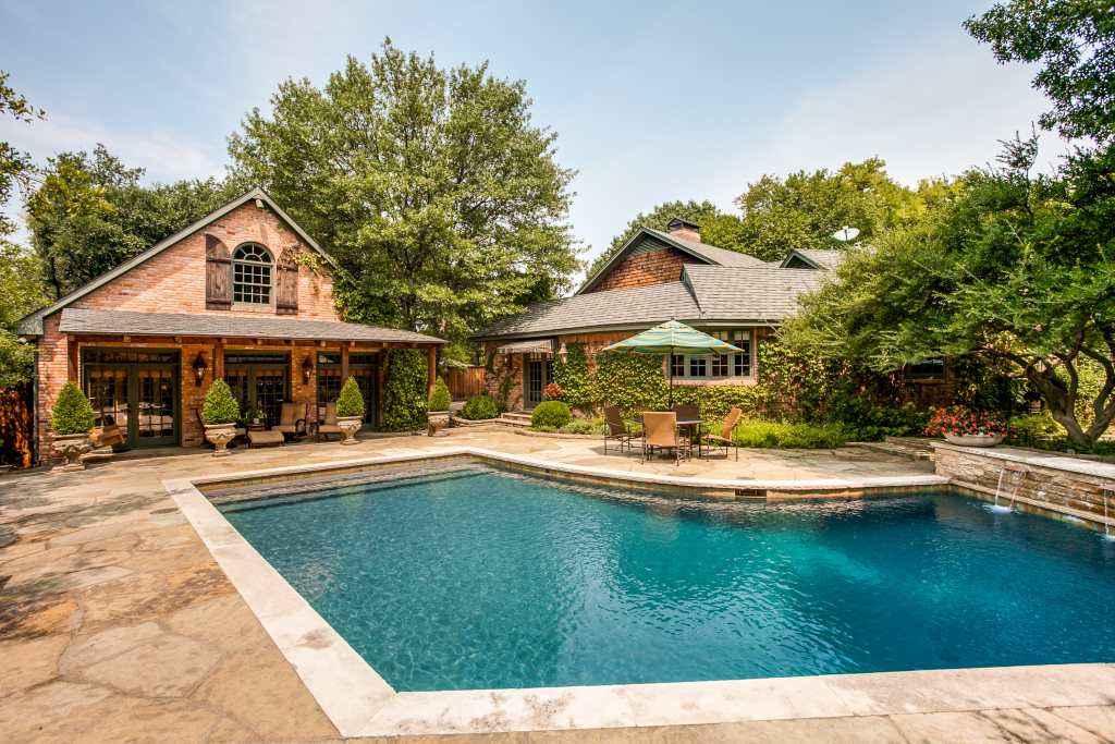 Rustic brick home with swimming pool