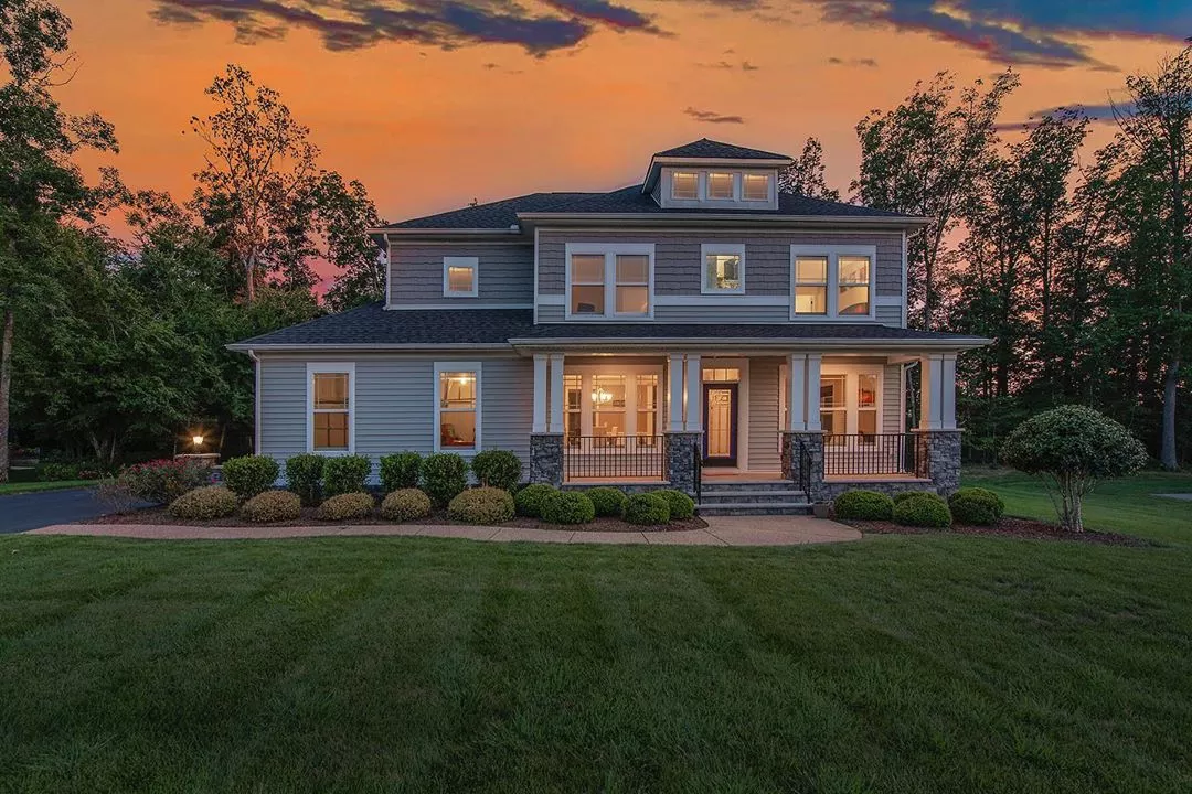 Craftsman style home at dusk