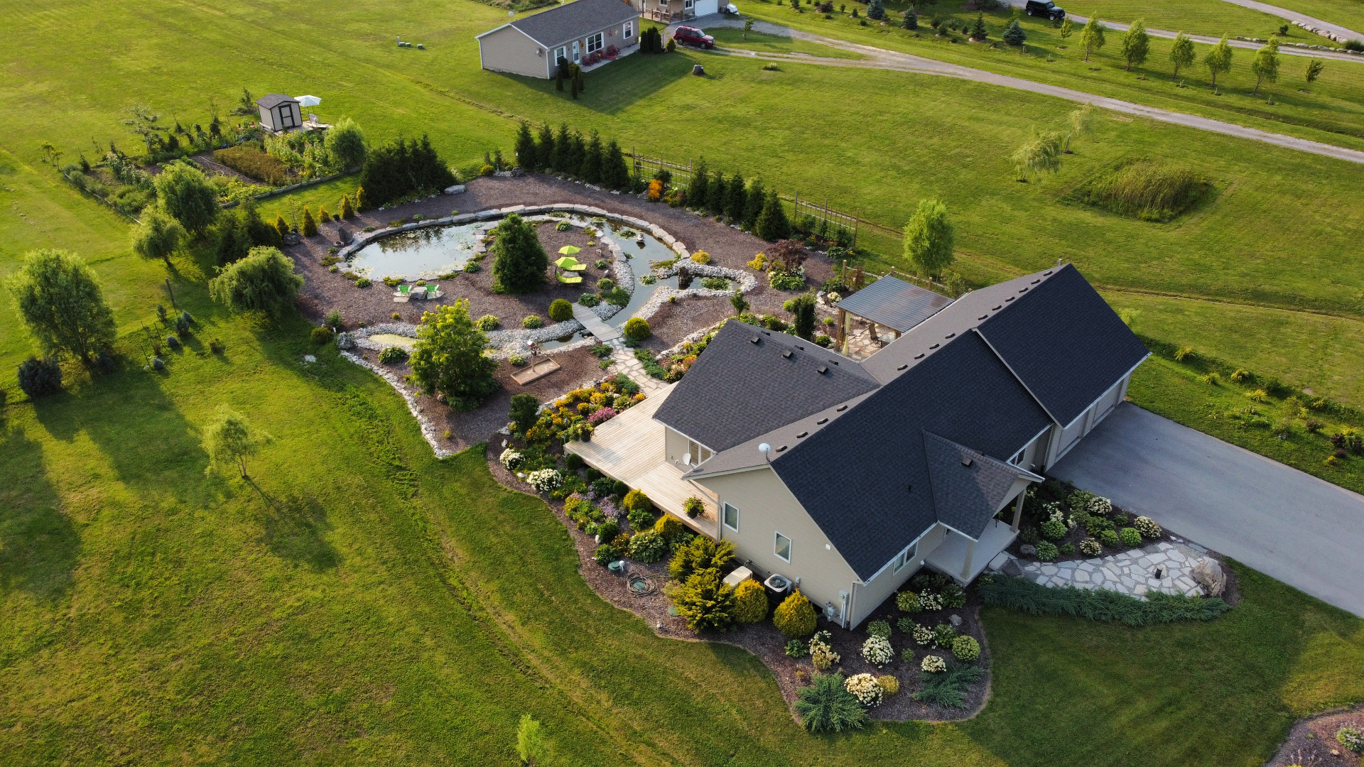 Country home with ornamental pond and gardens