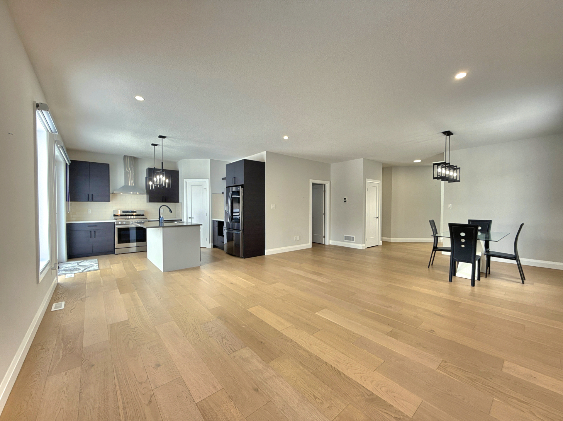 Virtually staged open concept kitchen and living area