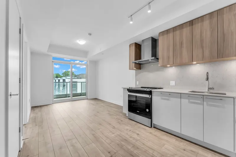 Condo kitchen and living area — Burlington real estate photography by Estate Shutter