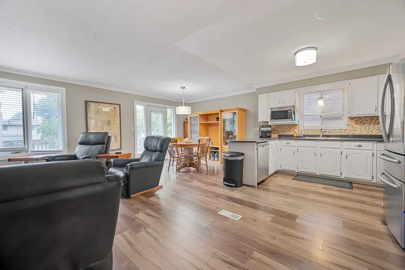 Open living room and kitchen — Strathroy real estate photography by Estate Shutter