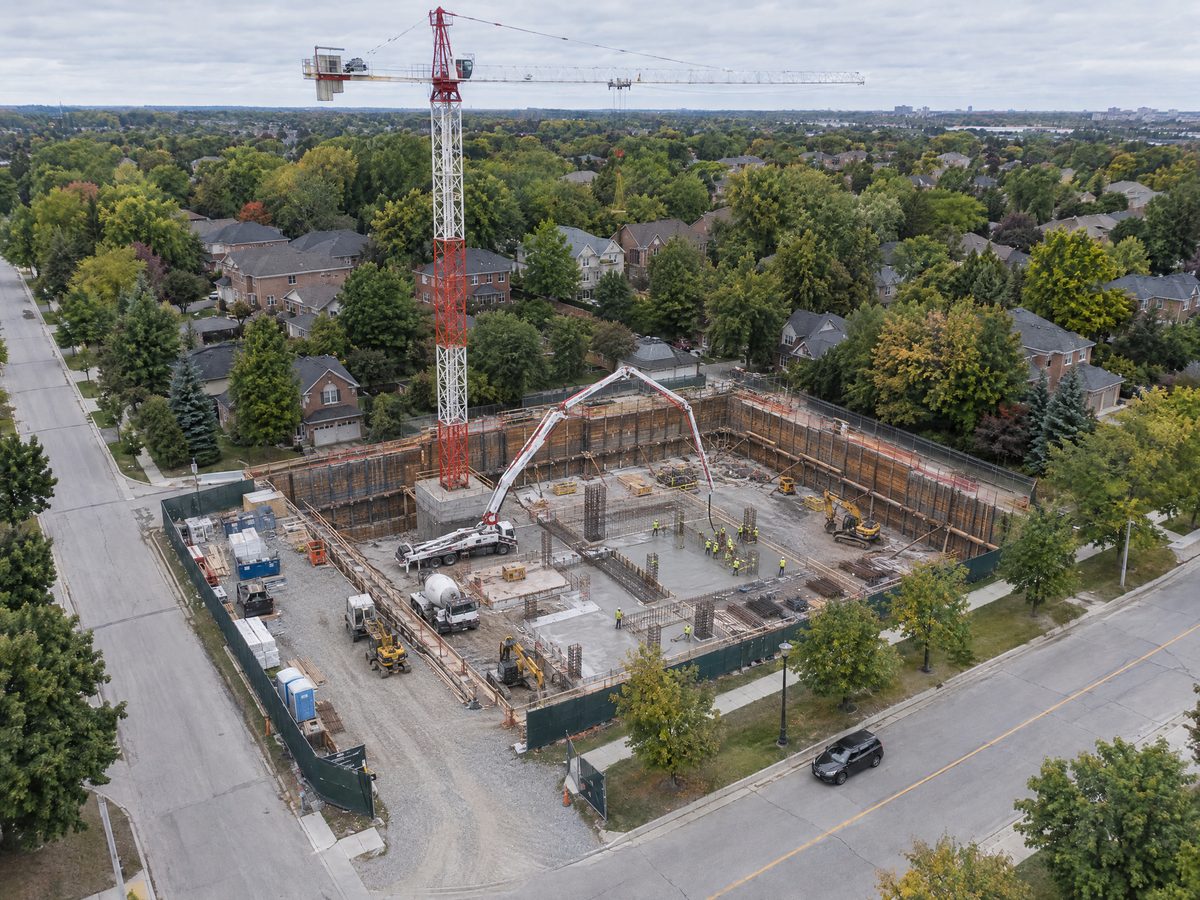Aerial view of a construction site at the excavation and foundation stage