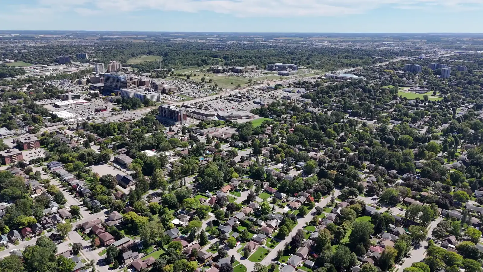 Aerial view over London, Ontario at golden hour, filmed by Estate Shutter