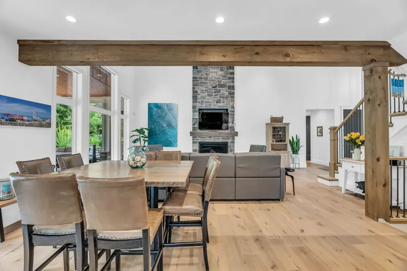 Lakefront great room with stone fireplace — Grand Bend real estate photography by Estate Shutter