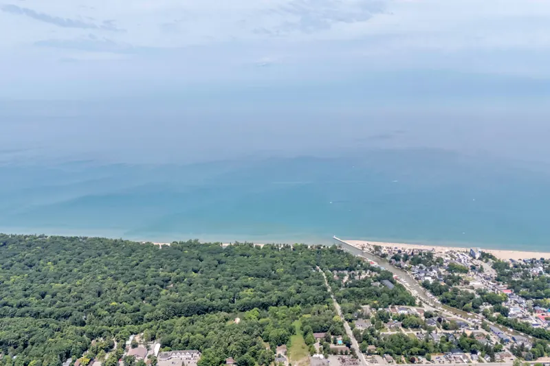 High aerial of the Lake Huron shoreline — Grand Bend real estate photography by Estate Shutter