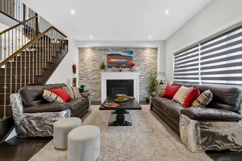 Living room with red sectional — Kitchener real estate photography by Estate Shutter