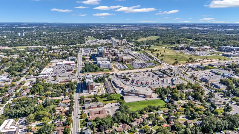 Commercial plazas, parking and neighbourhoods in south London — drone photo by Estate Shutter, London, ON