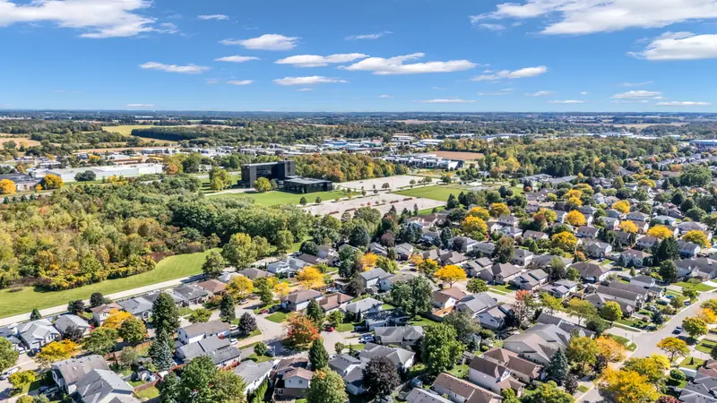 London, Ontario at daybreak, neighbourhoods running to the horizon — drone photo by Estate Shutter, London, ON