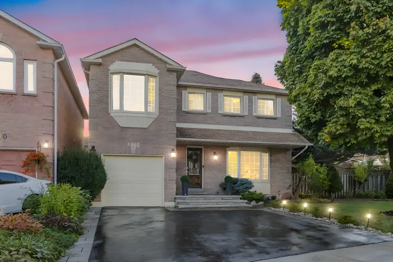 Two-storey home at twilight in Oakville — twilight real estate photography by Estate Shutter