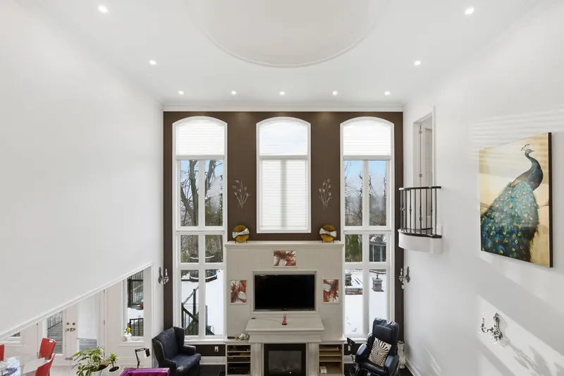 Two-storey great room with fireplace — Pickering real estate photography by Estate Shutter