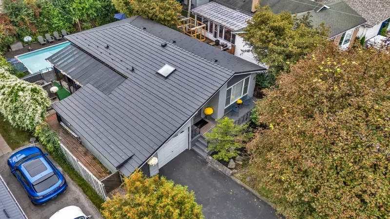 A standing-seam metal roof, skylights and eaves — drone photo by Estate Shutter, Pickering, ON