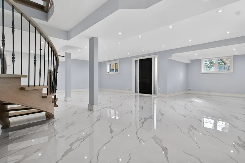 Marble foyer with curved staircase — Toronto real estate photography by Estate Shutter