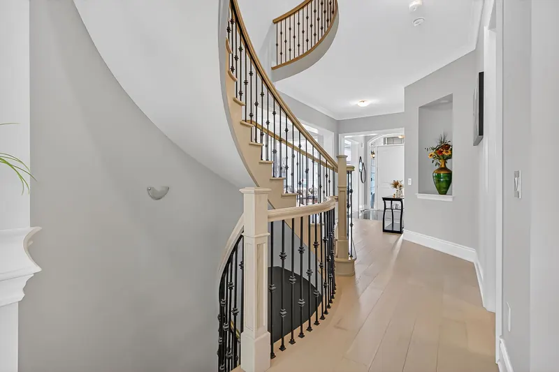 Curved staircase from the foyer — Vaughan real estate photography by Estate Shutter
