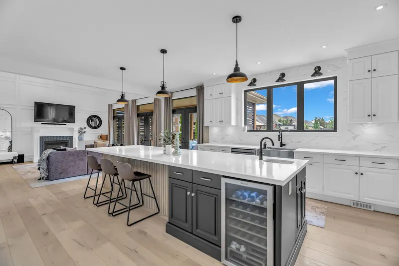 Kitchen with wood island and pendants — Woodstock real estate photography by Estate Shutter