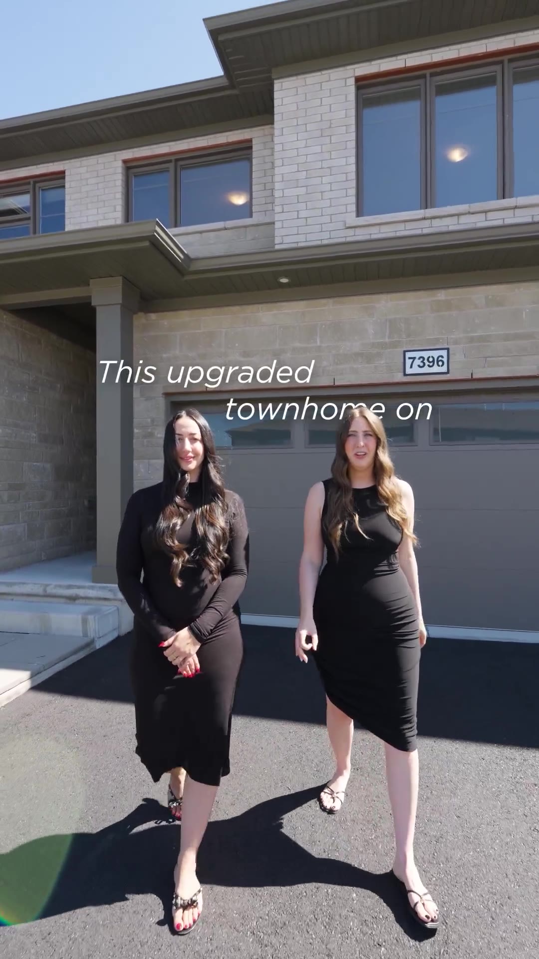 Vertical listing video: two on-camera hosts on the driveway of a Niagara Falls townhome